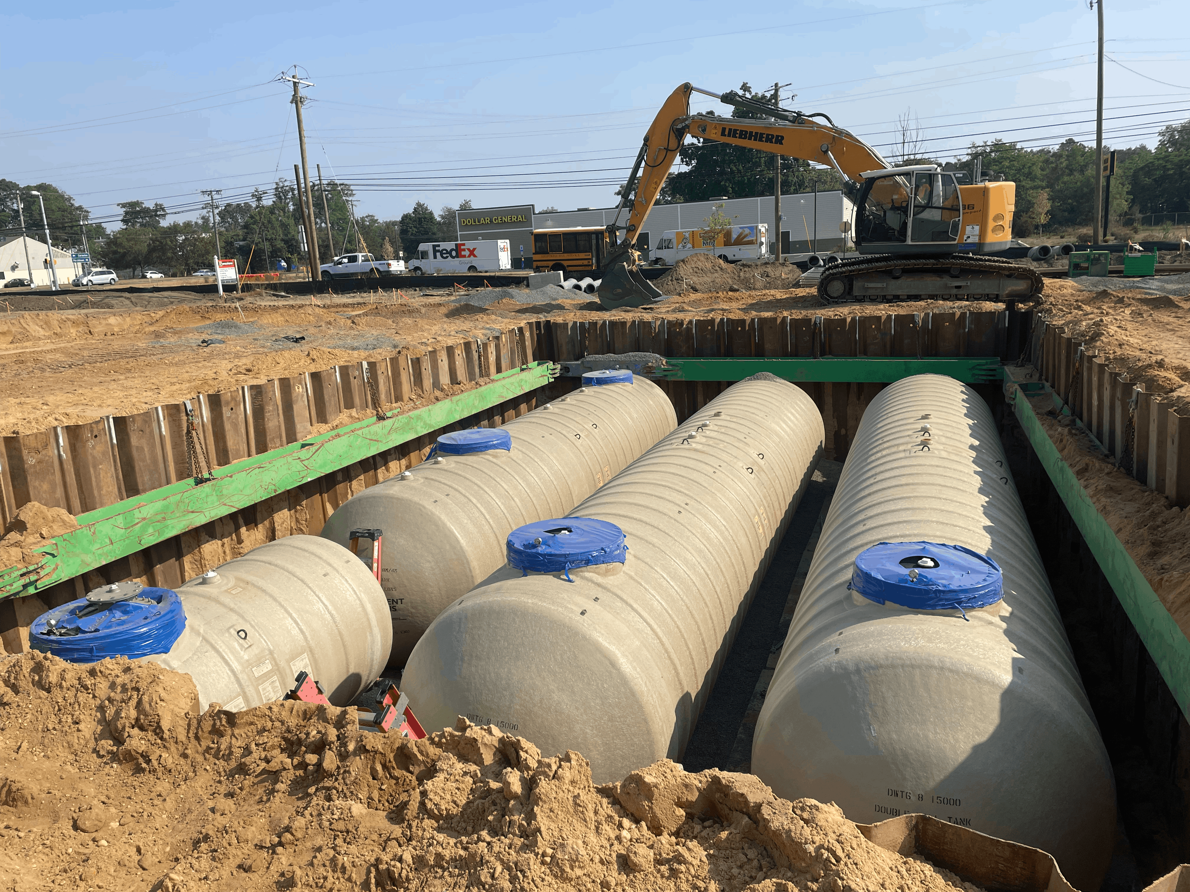 Underground storage tank installation with excavation and tank placement